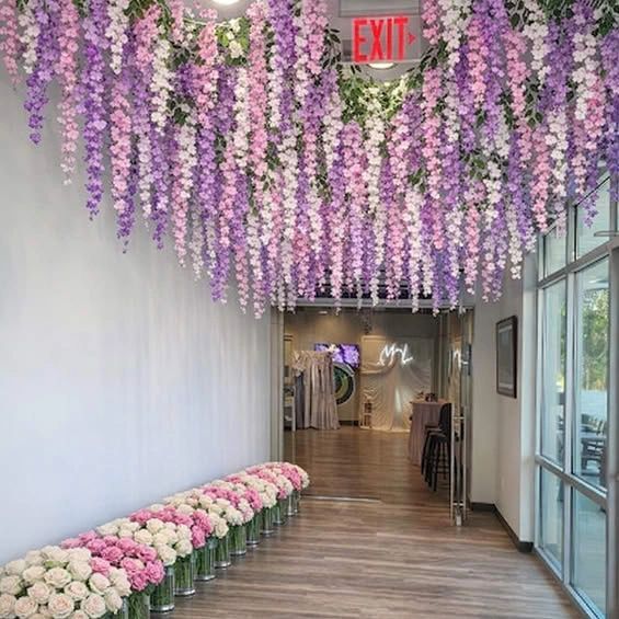 Team House Tampa floral corridor with cascading purple and white flowers
